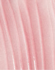 Close-up of pink fabric with a subtle pattern
