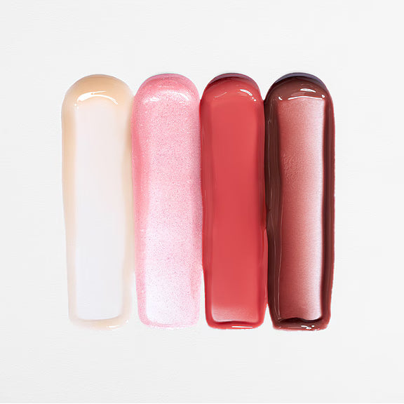 Four lip gloss tubes in different shades on a white background