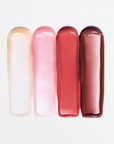 Four lip gloss tubes in different shades on a white background